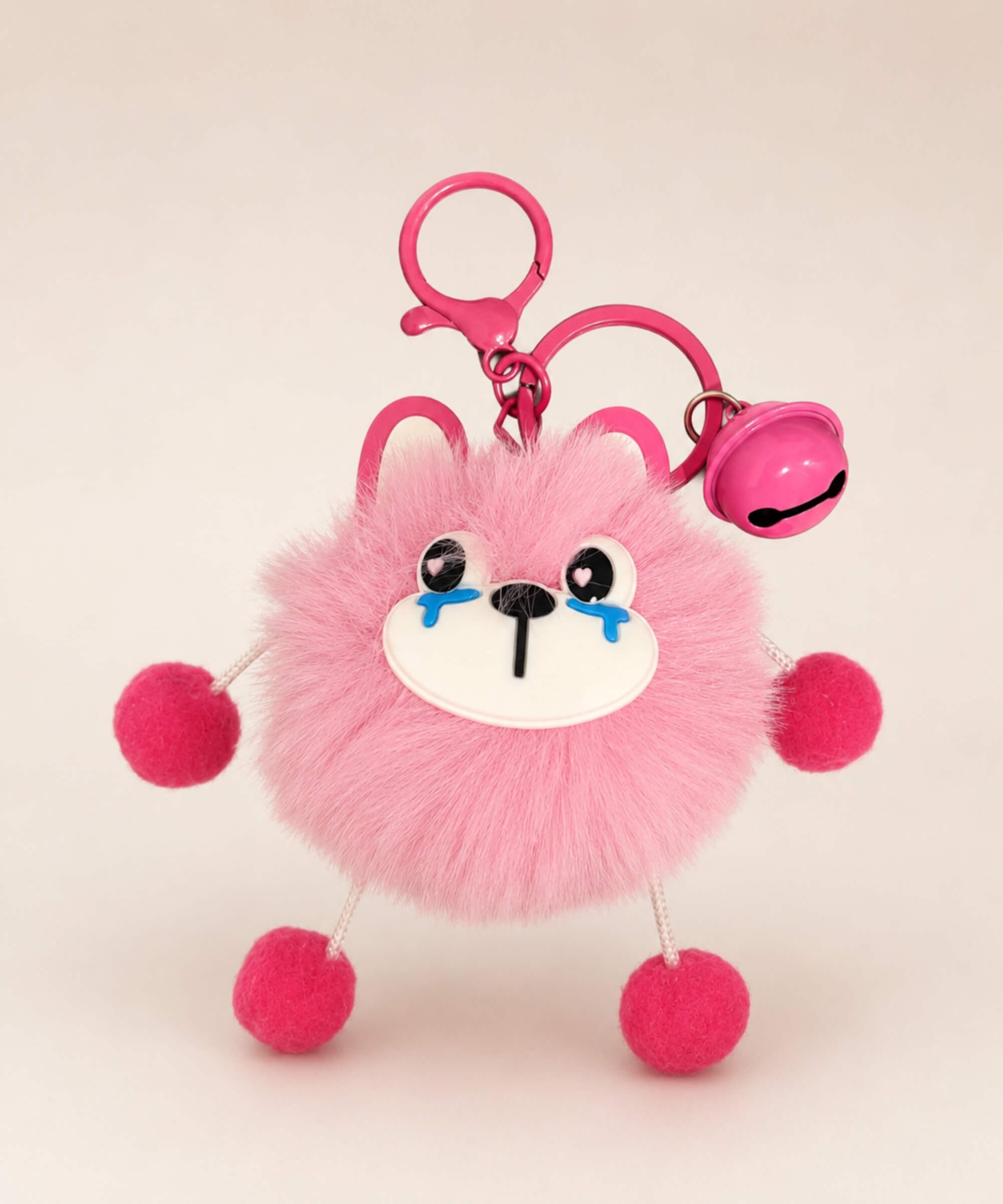 Rabbit plush keychain with pink fluffy body, cute crying face, bell charm and pink clip